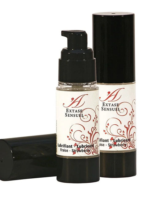 Schwarze pumpflasche extase sensuel erdbeer schmiermittel 30 ml mit weißem etikett und roten floralen mustern