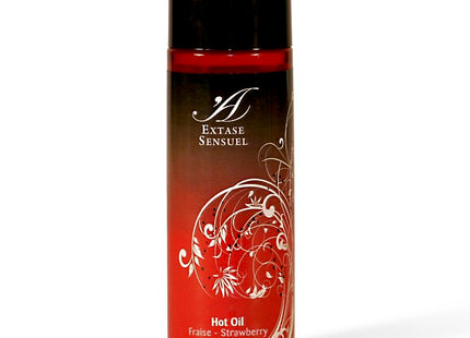 Rote transparente flasche extase sensual wärmestimulierendes öl erdbeer mit schwarzem deckel und weißem floralem muster