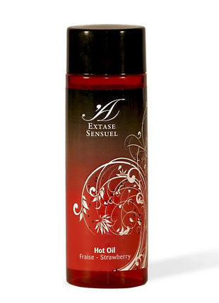 Rote transparente flasche extase sensual wärmestimulierendes öl erdbeer mit schwarzem deckel und weißem floralem muster