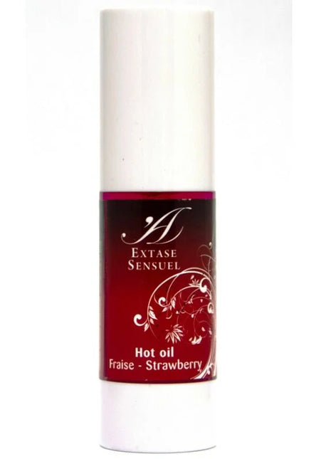 Ein schlanker weißer zylinderflasche mit rotem etikett und silbernen blumendesigns extase sensuel hot oil fraise erdbeeröl 30 ml