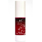Ein schlanker weißer zylinderflasche mit rotem etikett und silbernen blumendesigns extase sensuel hot oil fraise erdbeeröl 30 ml