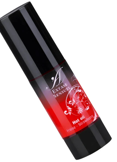 Schwarze zylinderförmige flasche mit rotem verlaufsetikett und weißem blumendesign für extase sensuel heißöl erdbeer 30 ml