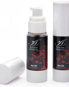 Zwei schwarze und weiße pumpflaschen extase sensuel hot oil mit roten blumendesigns für kubafrei wärmestmmulierendes öl 30 ml