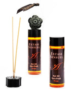 Schwarzer diffuser in blumenform mit mango duftendem heißöl nachfüllung und passenden schilfrohren extase sensual 100 ml