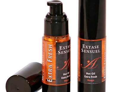 Extase Sensual Mango stimulierendes Öl 30 ml zwei schwarze zylindrische Flaschen mit bernsteinfarbener Flüssigkeit