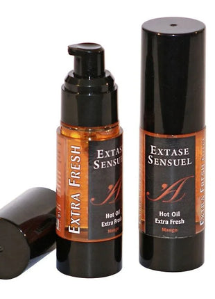 Extase Sensual Mango stimulierendes Öl 30 ml zwei schwarze zylindrische Flaschen mit bernsteinfarbener Flüssigkeit