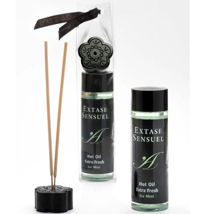 Schwarzer blumenförmiger diffuser mit holzstäbchen und passendem schwarzem deckel in klarer verpackung mit markenband für extase sensual massageöl mit eis effekt 100 ml