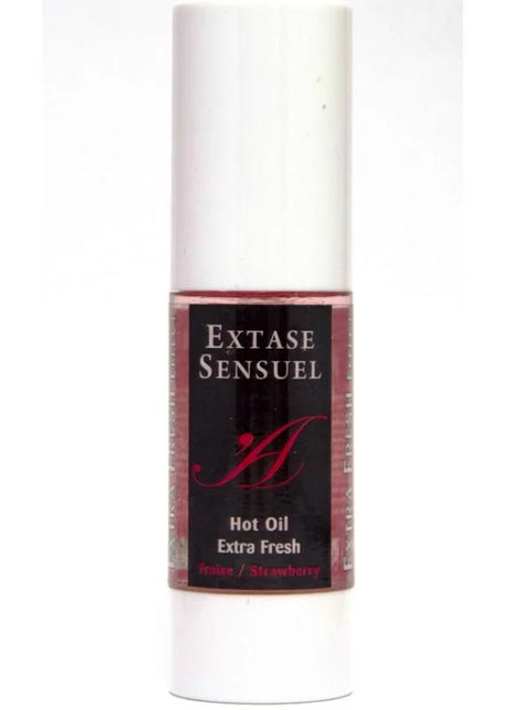 Ein schlanker weißer zylinderflasche extase sensuel massageöl mit extra frischem erdbeerduft 30 ml