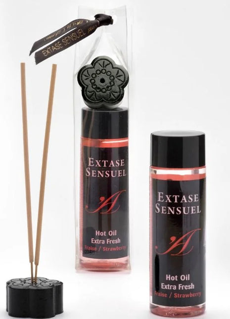 Schwarzer blumenförmiger diffuser mit rosewood sticks und extase sensuel massageöl mit erdbeereffekt 100 ml
