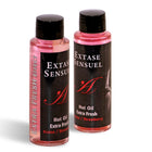 Zwei transparente plastikflaschen mit schwarzen verschlüssen und etiketten, pinkes massageöl extase sensuel hot oil erdbeerduft 100 ml