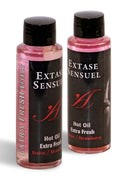 Zwei transparente plastikflaschen mit schwarzen verschlüssen und etiketten, pinkes massageöl extase sensuel hot oil erdbeerduft 100 ml