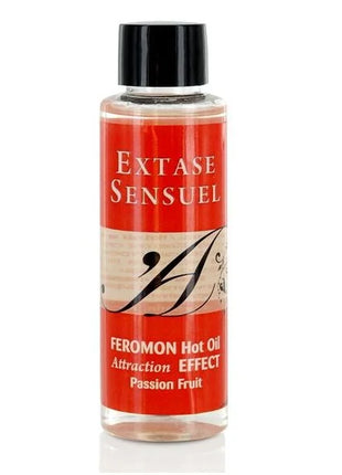 Ein klares glasfläschchen mit schwarzem verschluss und rotem beige etikett extase sensuel passionsfrucht pheromon massageöl 100 ml