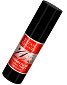 Schwarze zylindrische flasche mit rotem etikett extase sensuel massageöl mit wärmeeffekt und passionsfrucht pheromonen 30 ml