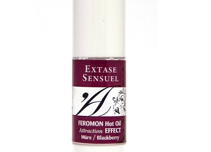 Ein schlanker weißer zylindrischer flakon extase sensuel massageöl mit wärmeeffekt und brombeer pheromonen 30 ml