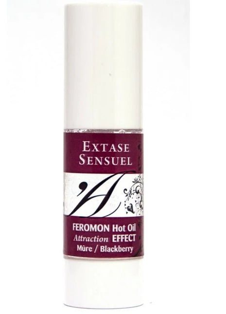 Ein schlanker weißer zylindrischer flakon extase sensuel massageöl mit wärmeeffekt und brombeer pheromonen 30 ml