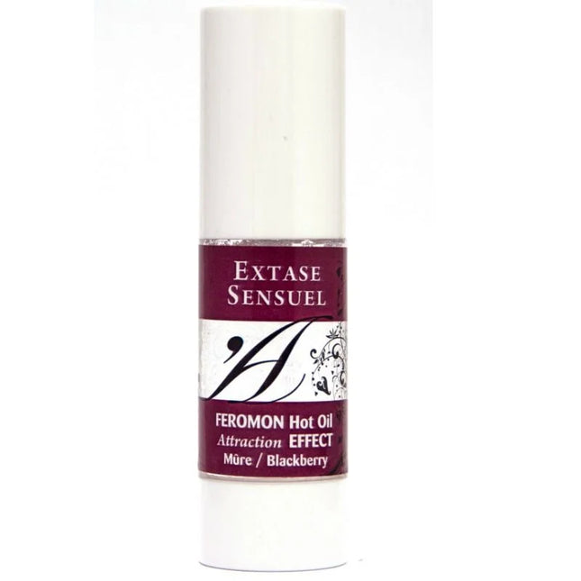 Ein schlanker weißer zylindrischer flakon extase sensuel massageöl mit wärmeeffekt und brombeer pheromonen 30 ml