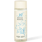 Eine klare glasflasche mit cremefarbenem deckel und etikett, blauen floralen mustern und extase sensuel branding, natürliches schmiermittel 100 ml
