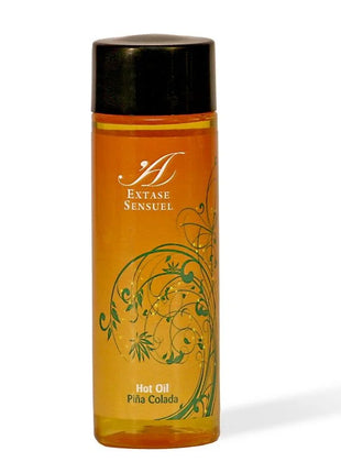 Orange glasflasche mit schwarzem deckel und grünem floralen design extase sensuel piña colada warmes stimulierendes öl 100 ml