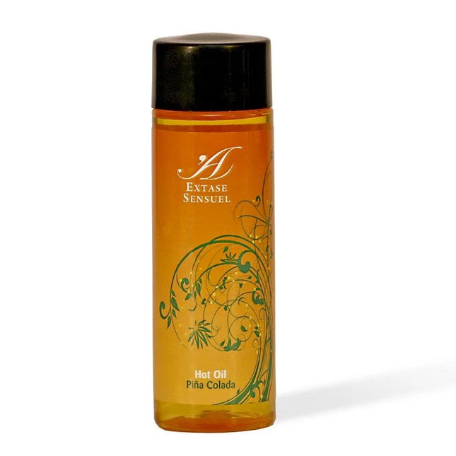 Orange glasflasche mit schwarzem deckel und grünem floralen design extase sensuel piña colada warmes stimulierendes öl 100 ml