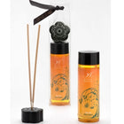 Schwarzer diffuser-stäbchenhalter in blumenform mit passendem deckel und dekorativem band für extase sensual öl