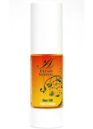 A sleek white cylindrical bottle with amber piña colada warm stimulating oil from extase sensuel with floral label