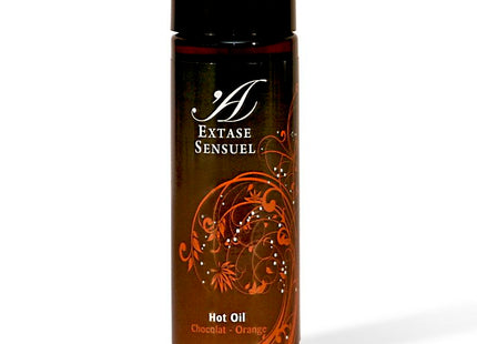 Ein elegantes dunkelbernsteinfarbenes glasfläschchen mit schwarzem verschluss und ornatem orangenblütendesign für extase sensual schokoladen und orangenen öl 100 ml