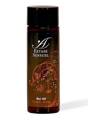Ein elegantes dunkelbernsteinfarbenes glasfläschchen mit schwarzem verschluss und ornatem orangenblütendesign für extase sensual schokoladen und orangenen öl 100 ml