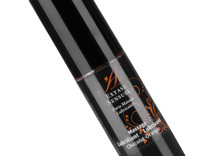 Schwarze zylinderflasche extase sensual massageöl im schokoladen-orange duft mit gold-braunem etikett 30 ml