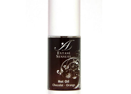 Ein eleganter weißer zylinderförmiger flakon mit dunkelbraunem etikett und silbernen floralen mustern extase sensuel öl schokolade-orange duft 30 ml