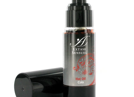 Schwarze pumpflasche extase sensuel heißes kolenöl mit silbernem etikett und roten floralen mustern 30 ml
