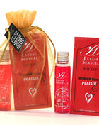 Red extase sensuel pocket hot oil in a clear glass bottle with silver cap and strawberry scent from extase sensual set nuits amour Reiseformat