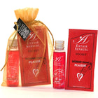 Red extase sensuel pocket hot oil in a clear glass bottle with silver cap and strawberry scent from extase sensual set nuits amour Reiseformat