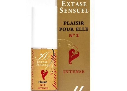 Eine gold-weiße parfümflasche mit rotem herz und label extase sensuel plaisir pour elle n°2 intense neben goldener box