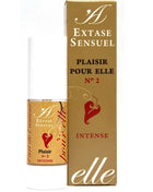 Eine gold-weiße parfümflasche mit rotem herz und label extase sensuel plaisir pour elle n°2 intense neben goldener box