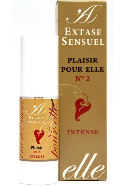 Eine gold-weiße parfümflasche mit rotem herz und label extase sensuel plaisir pour elle n°2 intense neben goldener box