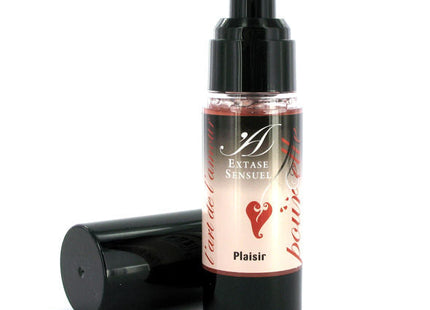 A sleek black pump bottle with clear glass and pinkish extase sensuel cream labeled with a red heart