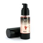 A sleek black pump bottle with clear glass and pinkish extase sensuel cream labeled with a red heart