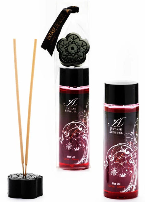Schwarzer reed diffuser mit blumenförmiger basis und dekorativem deckel mit zwei bernsteinfarbenen röhrchen extase sensual stimulierendes kirschöl 100 ml