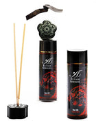 Schwarzes blumenförmiges reed diffuser set mit roten verzierten etiketten und goldakzenten extase sensual öl cuba libre 100 ml