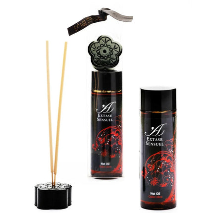 Schwarzes blumenförmiges reed diffuser set mit roten verzierten etiketten und goldakzenten extase sensual öl cuba libre 100 ml