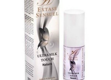 Weiße zylinderflasche extase sensual ultra silk touch naturöl mit silber-lila etikett und schmetterlingsdesign