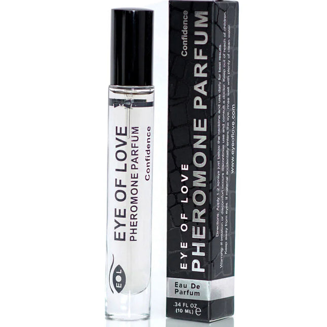 Klare glas-rollerflasche mit schwarzem deckel und weißem etikett eye of love pheromon parfum von confidence neben schwarzer box