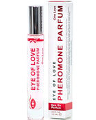 Ein klarer glas-rollerflakon mit silbernem deckel und roter aufschrift eye of love pheromon parfum neben weißer box
