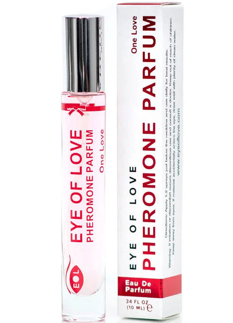 Ein klarer glas-rollerflakon mit silbernem deckel und roter aufschrift eye of love pheromon parfum neben weißer box