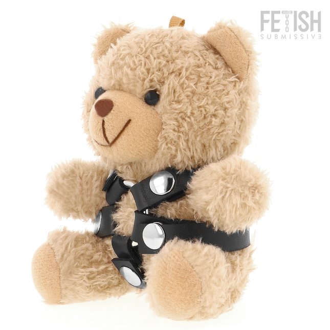 Ein kuscheliger brauner teddybär mit schwarzem lederharness und silberfarbenen schnallen im fetish submissive stil