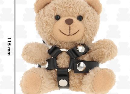 Ein plüschiger beiger teddy bär mit schwarzem ledergeschirr und silberner metallbeschläge im bdsm modell 4