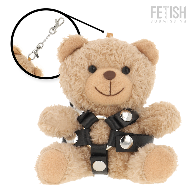 Ein plüschiger brauner teddyär mit schwarzem ledergeschirr und silbernen metallbeschlägen für bdsm model 4