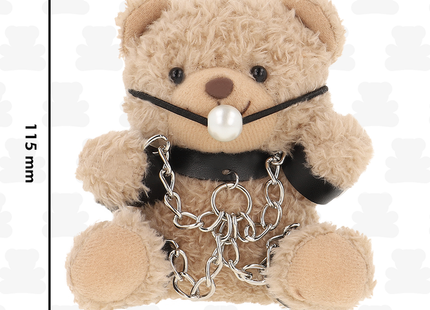 Beiger plüsch teddy bear mit schwarzen lederriemen, perlennase piercing und silberketten im fetish submissive stil