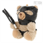 Ein plüschiger teddy mit beigem fell, schwarzer ledermaske und schwarzem lederflogger fetisch submissive modell 7