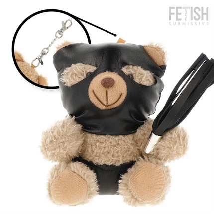 Black ledermaske bedeckter teddy mit hellbraunem fell und lächelndem gesicht hält schwarzen peitsche für bdsm spielzeug